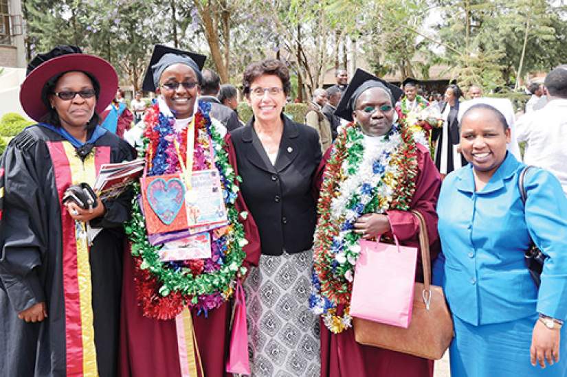 Sr. Rosemarie Nassif, SSND, Ph.D., Director of the Conrad N. Hilton Foundation’s Catholic Sisters Initiative (center), was the keynote speaker for the graduation ceremony at CUEA (October, 2016). Here she poses with HESA graduates, ASEC directors, and Dr. Ann Rita Njageh, Deputy Director of  Academic Linkages of CUEA, after the ceremony.