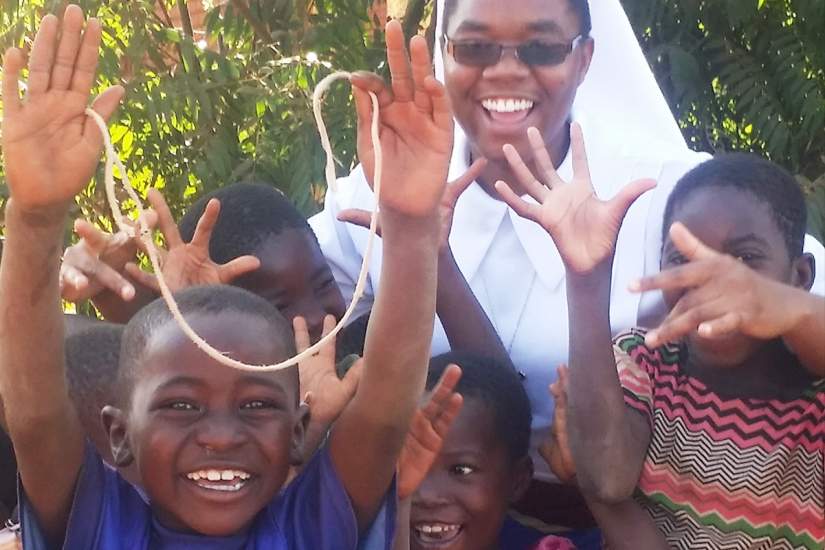 Sr. Dorice with the children after teaching catechism.