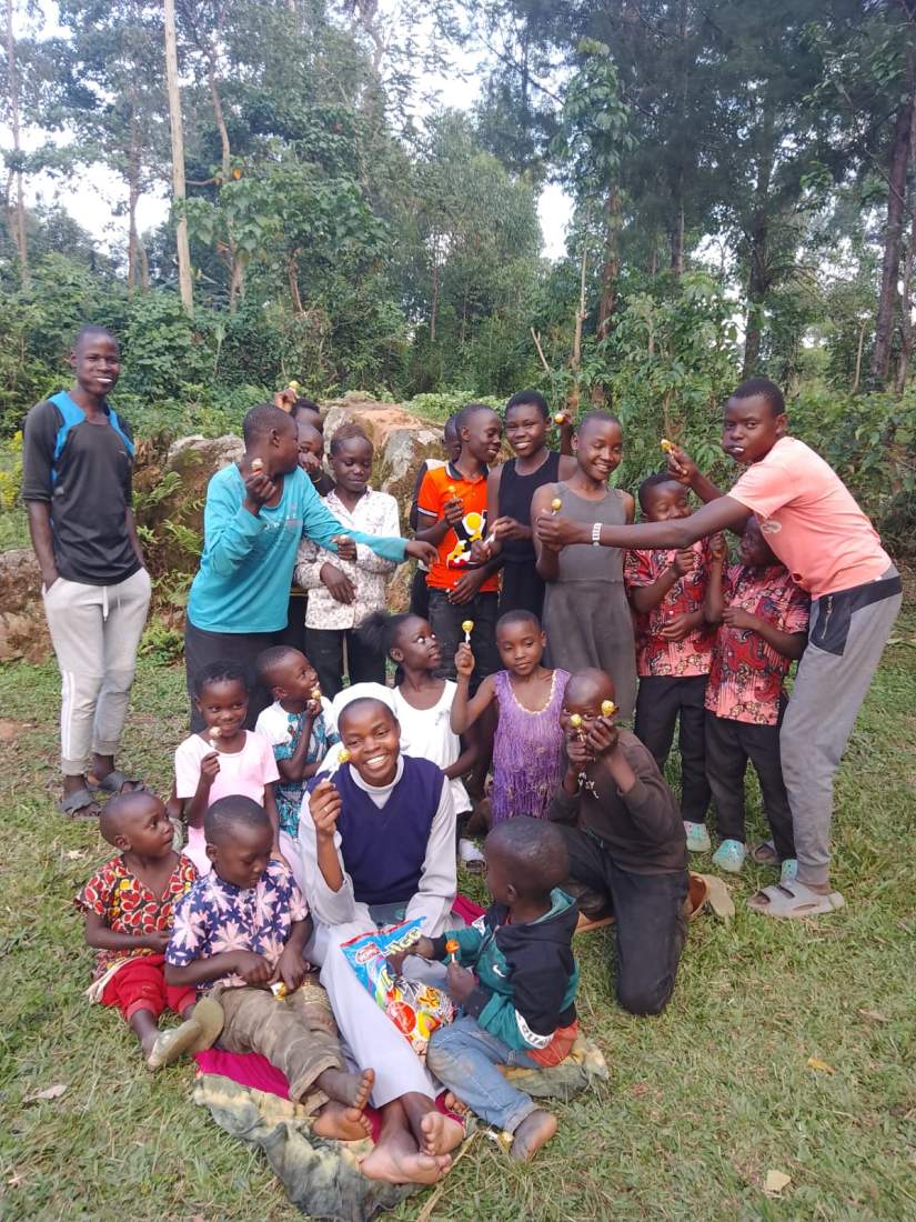 Sr. Lydiah joining with the young ones in the village.