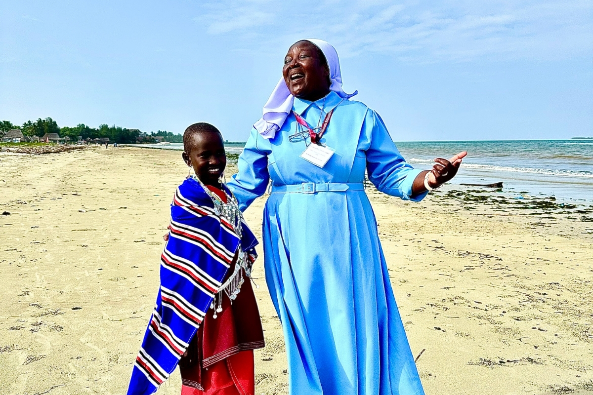 ASEC Executive Director Sr.Draru Mary Cecilia, LSMIG and Joyce, a 12-year-old Maasai girl, walk together on the coast of Tanzania along the Indian Ocean.