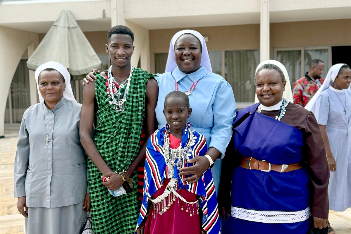 ASEC Executive Director Sr.Draru Mary Cecilia, LSMIG and Joyce, a 12-year-old Maasai girl, walk together on the coast of Tanzania along the Indian Ocean.