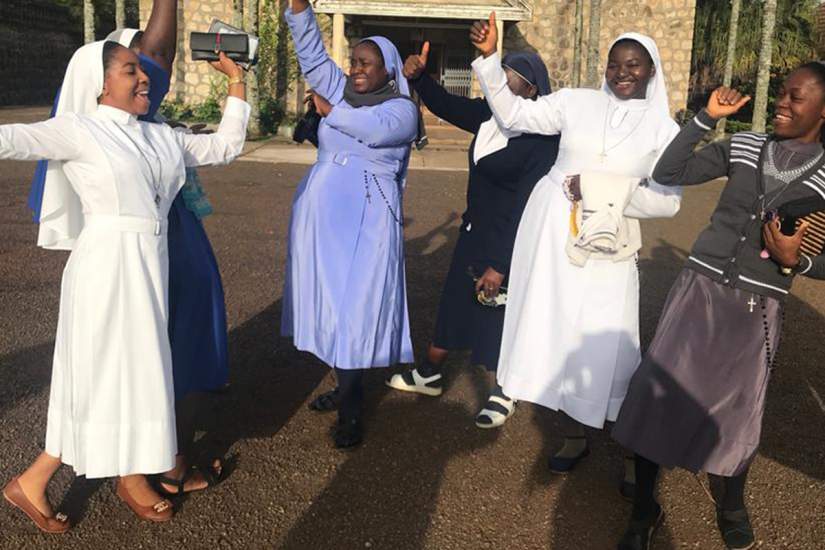 Sisters in Cameroon dancing together when reunited with friends at the HESA Reflective Workshop (2019). 90% of enrolled HESA students participated in 13 HESA reflective learning workshops across 10 countries.