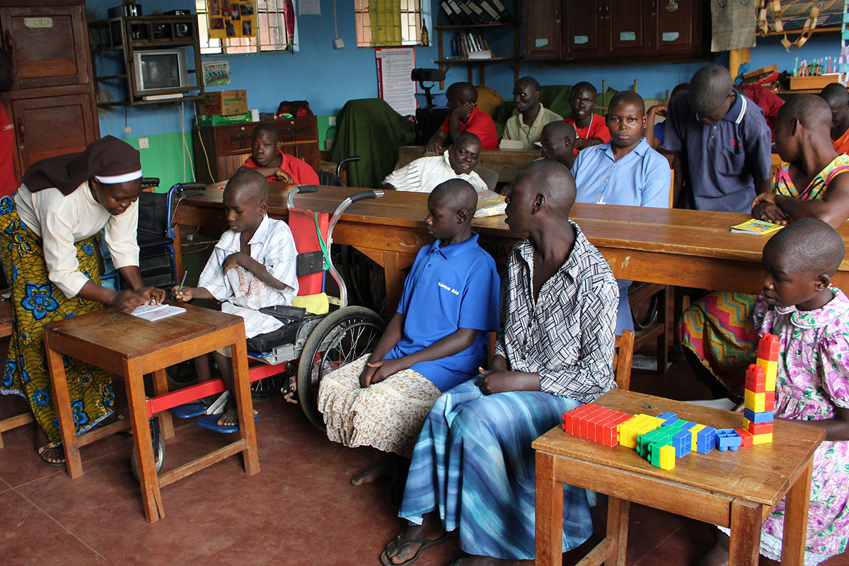 Sr. Swai working with a disabled child at Providence Home.