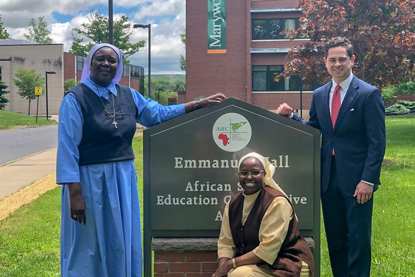 ASEC Executive Director Sr. Draru Mary Cecilia, LSMIG, Ph.D. of Uganda (left) and ASEC Asst. Director of Development Sr. Nancy Kamau, LSOSF, of Kenya (center) pose with Hon. Kyle J Mullins (right) at ASEC's headquarters, located on Marywood University's campus in Scranton, PA