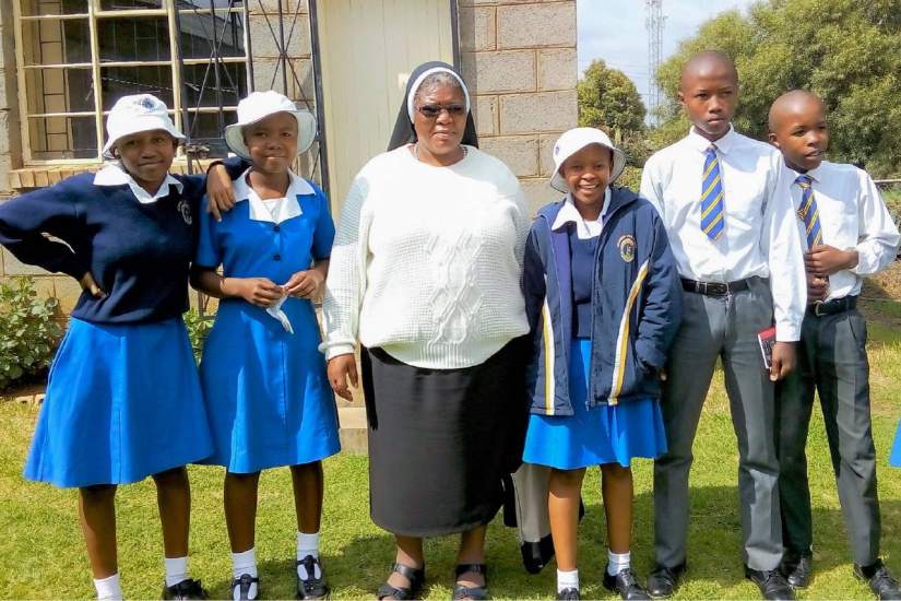 Sr. Augustina (center) with students of Mazenod High School in Maseru, Lesotho.