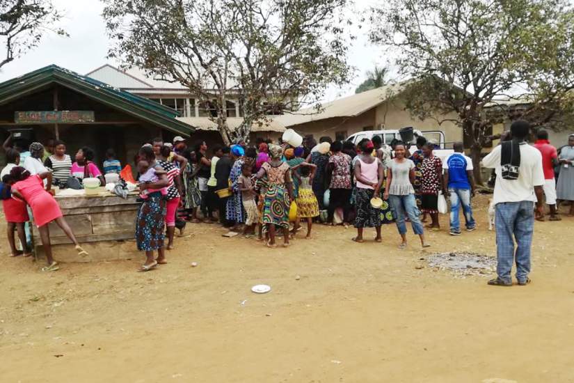 In this displaced village in Cameroon, the struggling villagers collect much-needed supplies from the sisters of the socio-cultural Commission.
