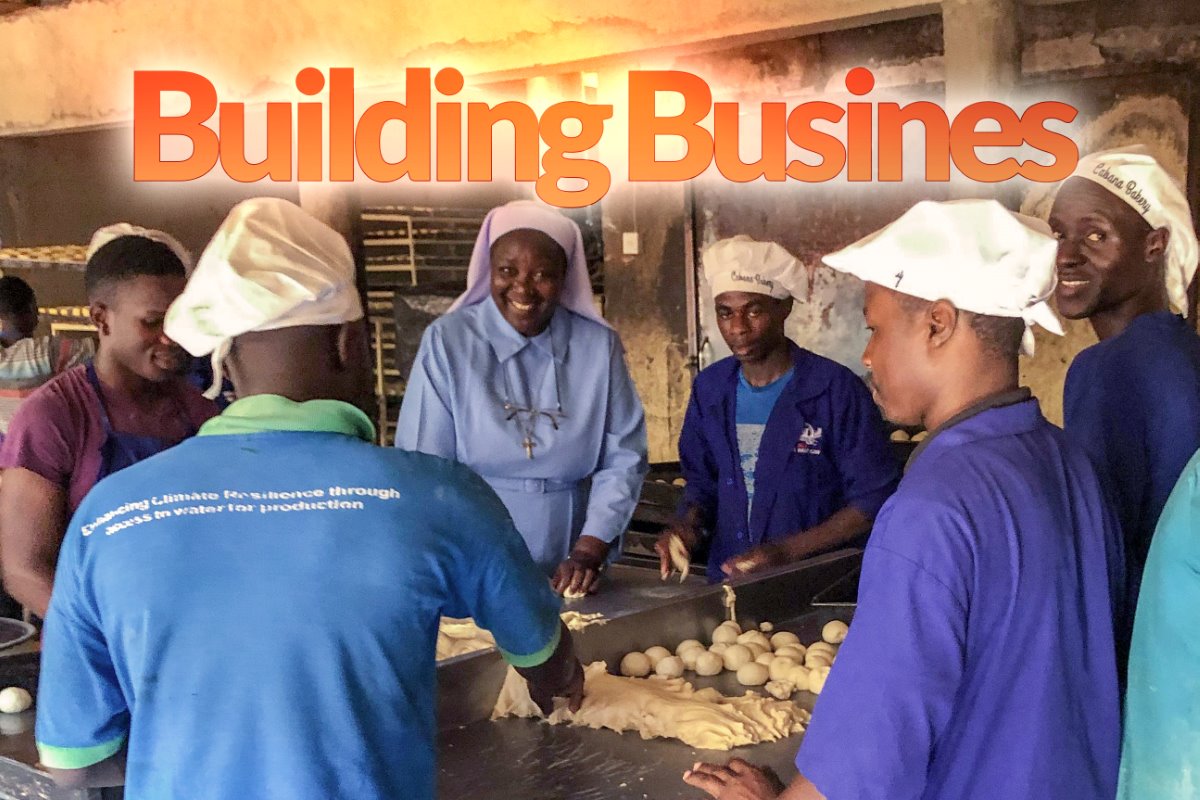 Executive Director, Sr. Draru Mary Cecilia, tries her hand at baking bread during a staff site visit to Cabana Sisters' Bread Bakery in Uganda. The Cabana Bakery is run by SLDI and HESA alumna Sr. Maria Teopista Namigga and the Immaculate Heart of Mary Reparatrix (IHMR) Sisters.