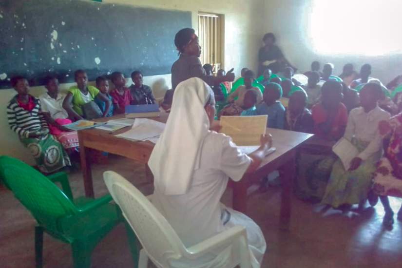 Sr Sonia and Agnes in a support group session with HIV positive children.