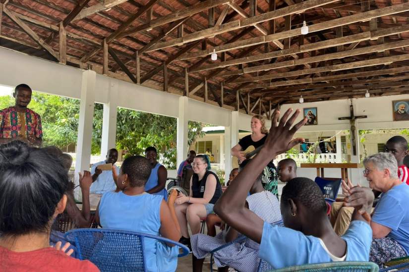 D’Ambra shares a moment of joy and connection through music during ASEC’s 2025 Service Learning trip in Ghana, using her guitar to bridge cultures and hearts.