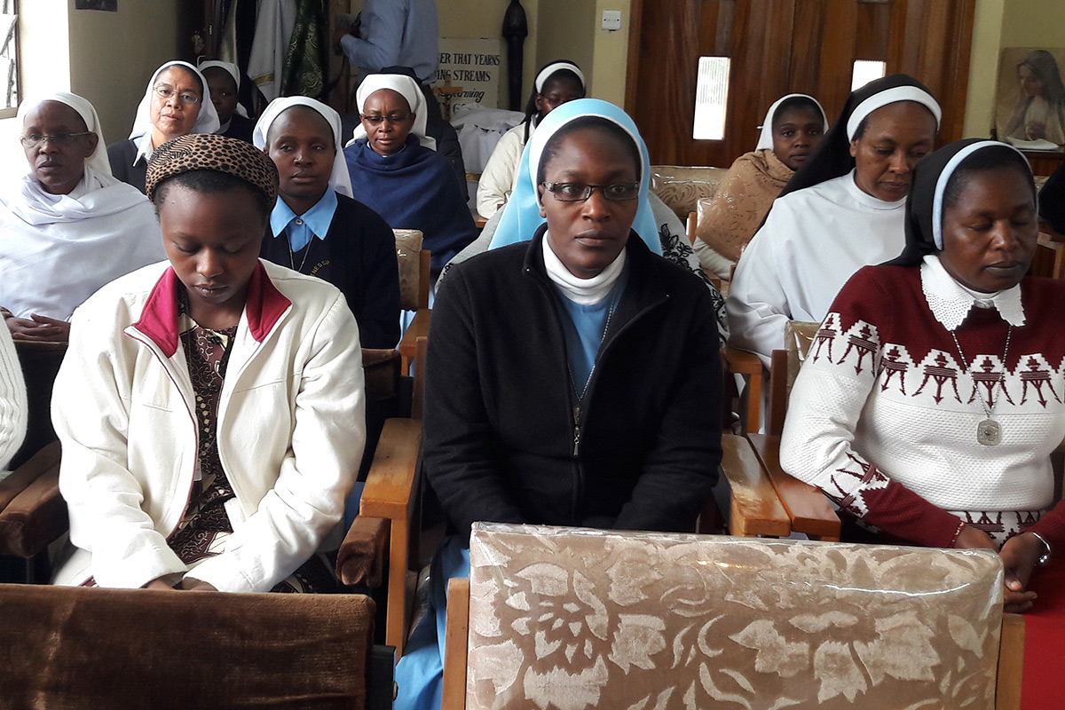 SLDI workshop participants in Kenya meditate together before mass.