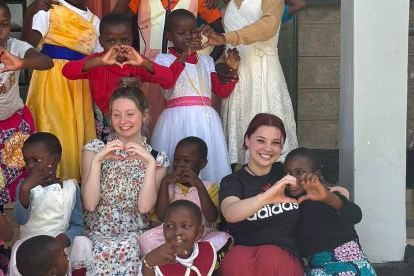 Madilyn Grose (right), a sophomore in Art Therapy at Marywood University, shares joyful moments with fellow students and children in Kenya during ASEC’s 2024 Service Learning trip.
