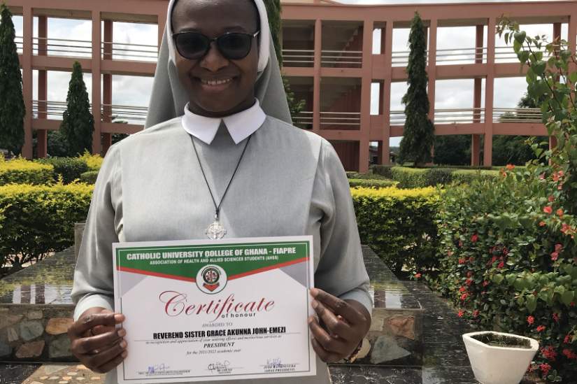 Sr. Grace Akunna John-Emezi holds her certificate at a HESA reflective learning workshop in Ghana in 2022.