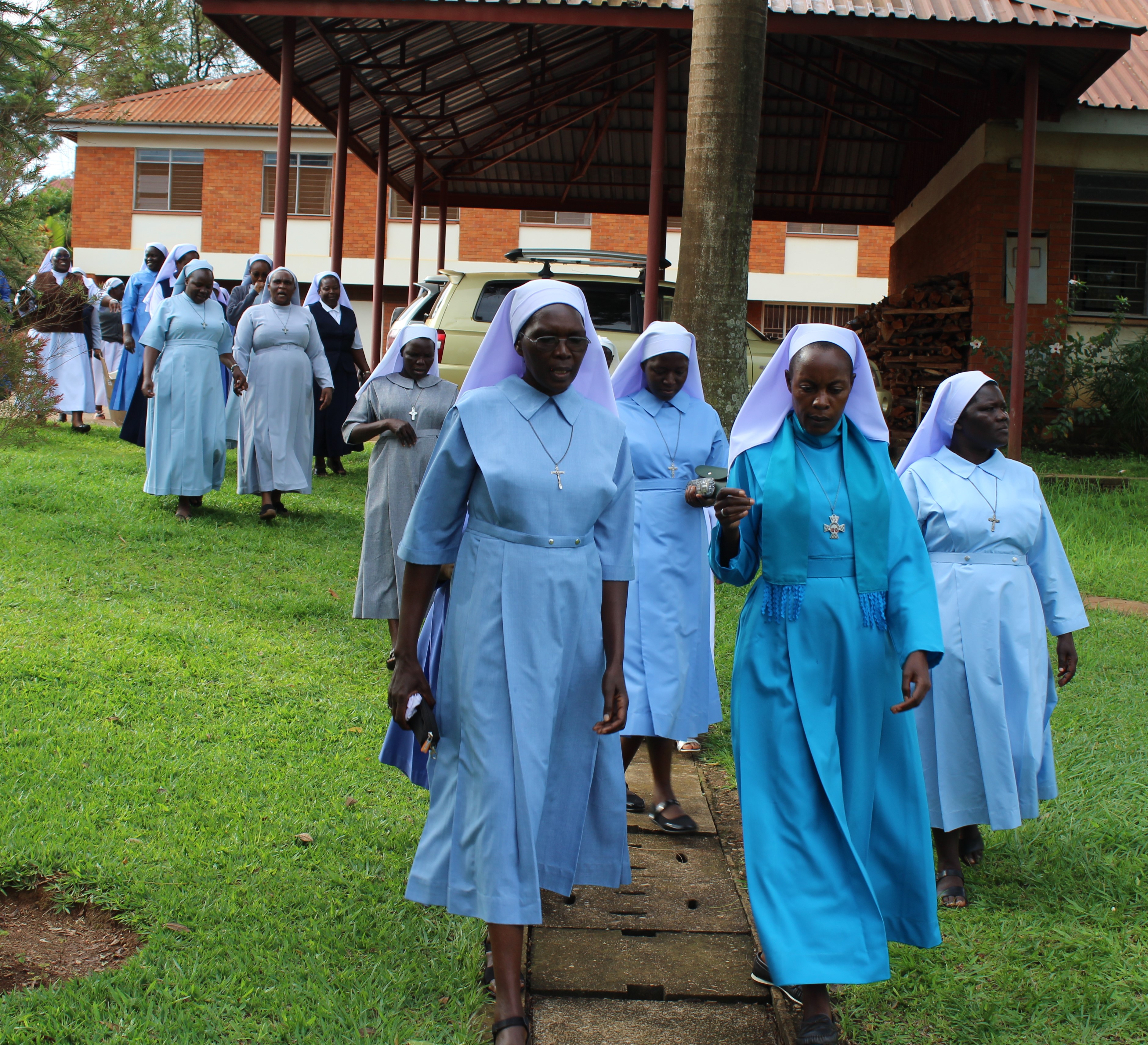 ASEC Sisters are pictured walking during a HESA Reflective Learning workshop in Uganda, 2022.
