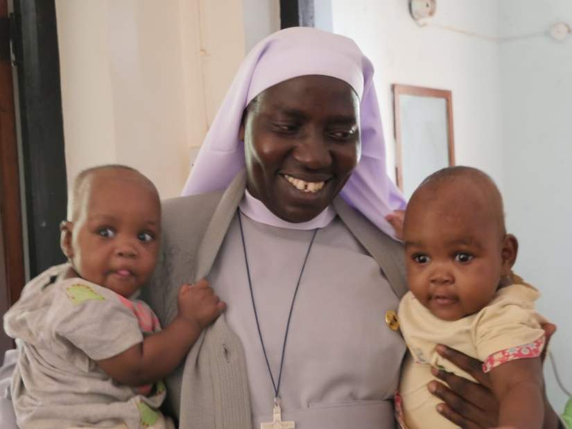 Sr. M. Tryphina Burchard, STH, ASEC Country Director – Tanzania, spends time with the young orphans of Mgolole Orphanage Centre in Morogoro, Tanzania.