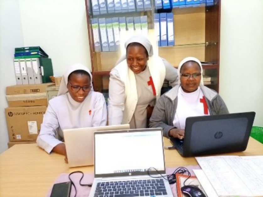 Sr. Rebecca mentoring some members of the leadership team in finance skills
