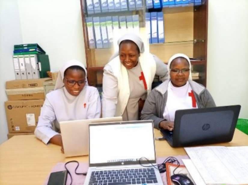 Sr. Rebecca mentoring some members of the leadership team in finance skills