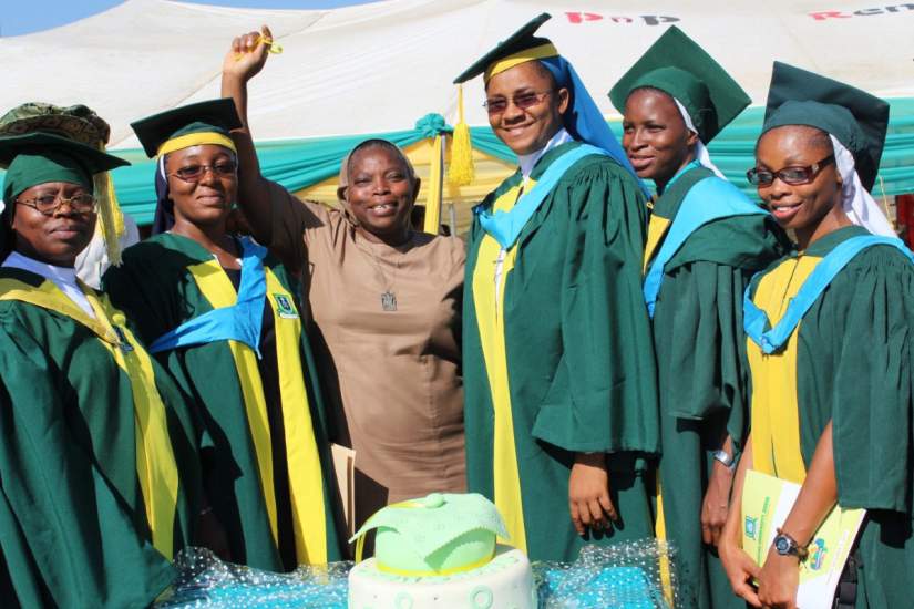 The first 14 Nigerian sisters graduated from Veritas University through ASEC's HESA program on December 5, 2017. Here, some of the sisters pose for a photo with Sr. Clementina Obembe, OSF, ASEC Regional Director – West Africa.