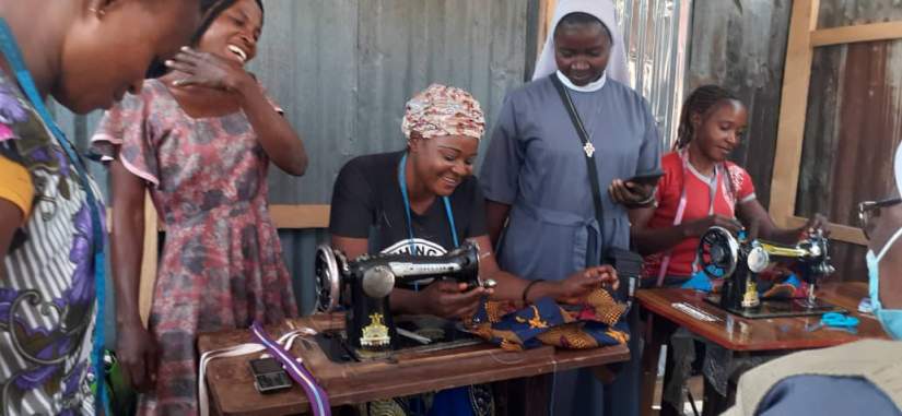 Women learning to sew as part of the program in Nigeria