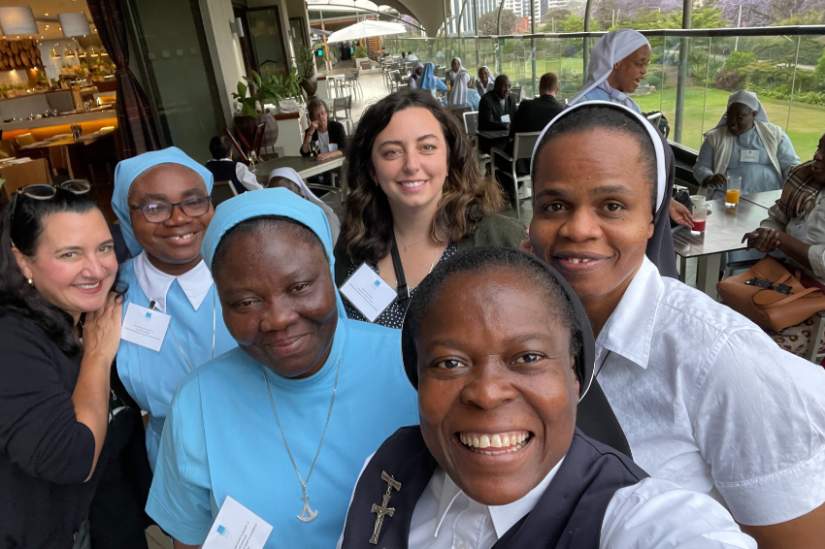 U.S. staff and Africa staff members meet at the Conrad N. Hilton Convening, October 2022.