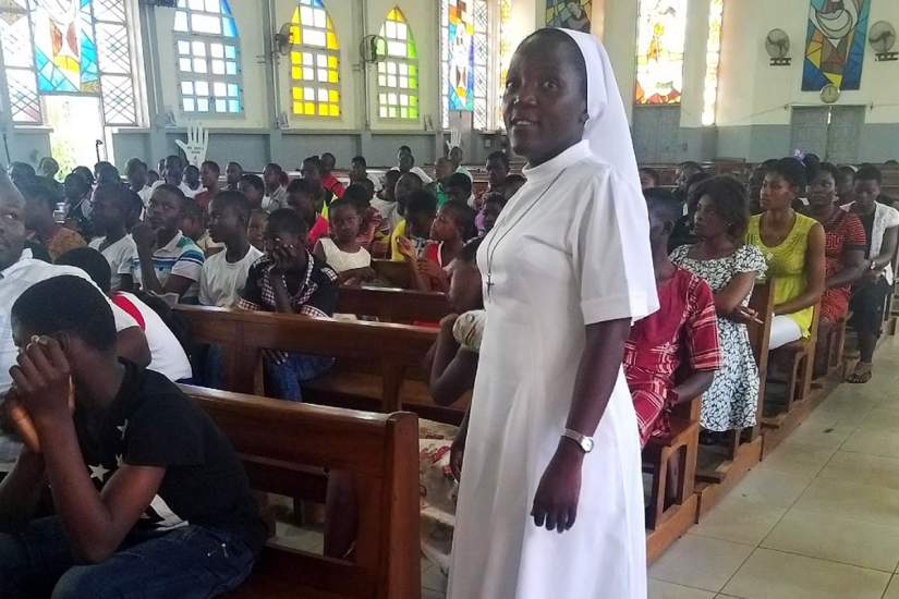 SLDI participant Sr. Vera Ndifoin prepares to give a motivational speech to 100 women and children.