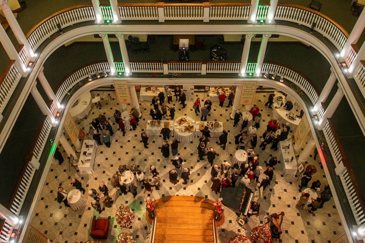 Guests enjoy a lively cocktail hour at ASEC's 25th Anniversary Gala in the beautiful rotunda of Chestnut Hill College.