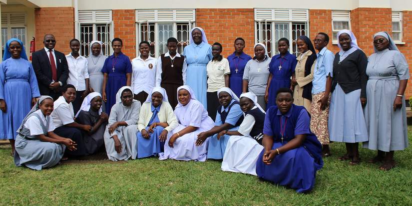 Sr. Draru Mary Cecilia, LSMIG (back row, center) poses for a group photo with participants of the SLDI Finance II Workshop in Uganda.