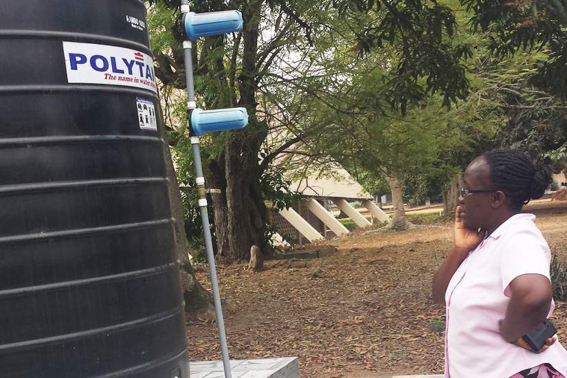 Sr. Mary Lucy inspects the water system that will bring clean water to 13 schools and thousands in her community in Ghana. The project uses water treatment systems to filter and chlorinate the water, making it safe to drink.