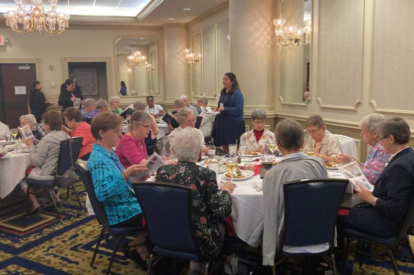 Senior Program Manager Rosemary Shaver speaks to dinner guests about the impact of ASEC programs in Africa.