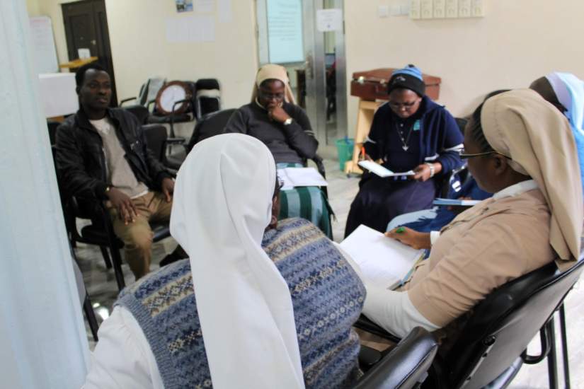 Sisters participating in group work during the SLDI Administration workshop.