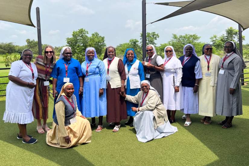 Megan with ASEC staff and alumnae during the workshop in Zambia, reflecting the strong sense of community and collaboration that shaped the week.