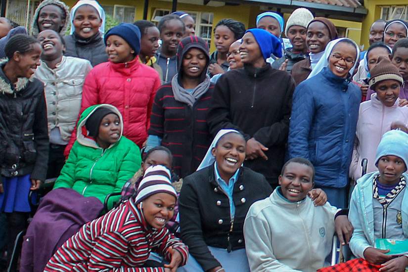 Director of Cheshire Home for Girls with Disabilities, Sr. Anne Kamene poses with the girls she loves and protects. About 90% of the girls at the home have experienced some form of sexual abuse and Sr. Anne is a fierce advocate for their protection and mental health. Read more about Cheshire Home.