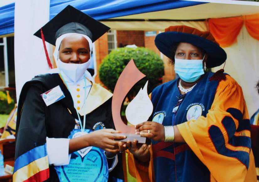 Sr. Mary Kulume, MSMMC, receiving Best in Education Department award at Univeristy of Kisubi graduation, Uganda.