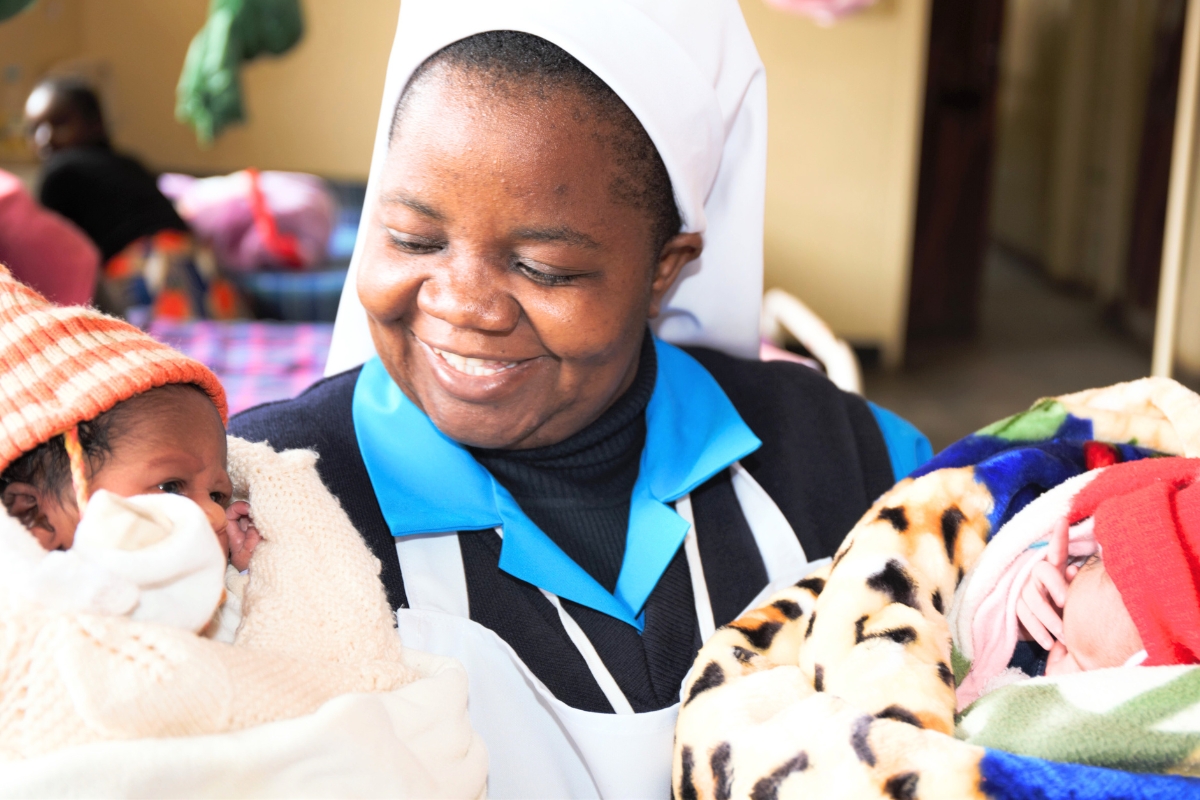 Sr. Given Chibesakunda, CSJB, Scholarship recipient in Zambia holds newborn twins.