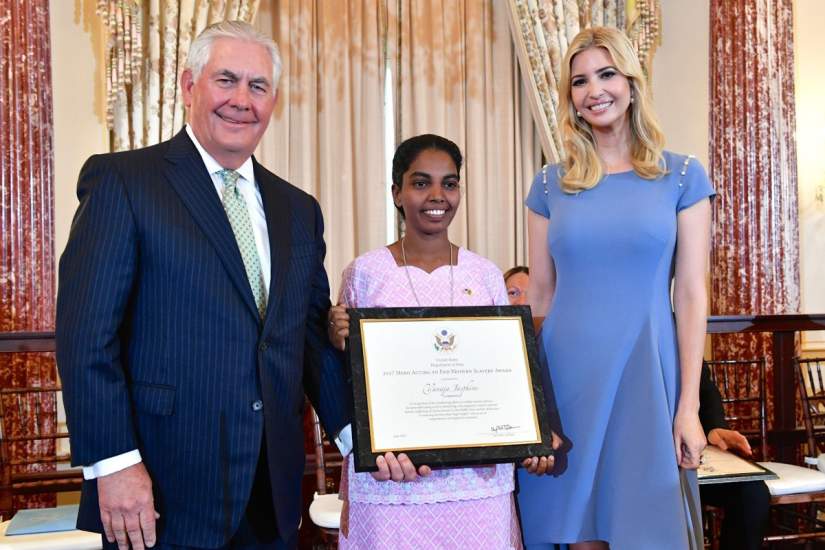 U.S. Secretary of State Rex Tillerson and Advisor to the President Ivanka Trump pose for a photo with 2017 TIP Hero Vanaja Jasphine of Cameroon, whose tireless efforts have made a lasting impact on the fight against modern slavery, at the 2017 Trafficking in Persons Report Launch Ceremony, at the U.S. Department of State in Washington, D.C., on June 27, 2017. [State Department photo/ Public Domain]