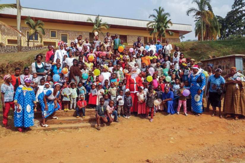 Group photo of the Christmas party attendees. The children left the party with smiles on their faces and joy in their hearts.