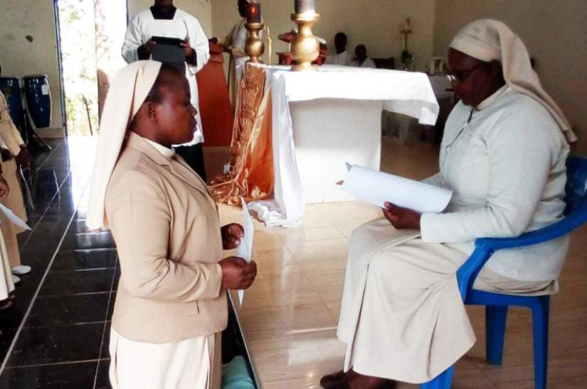 Sister Margaret Wanda in her role as a superior graciously receives the vows of a junior sister