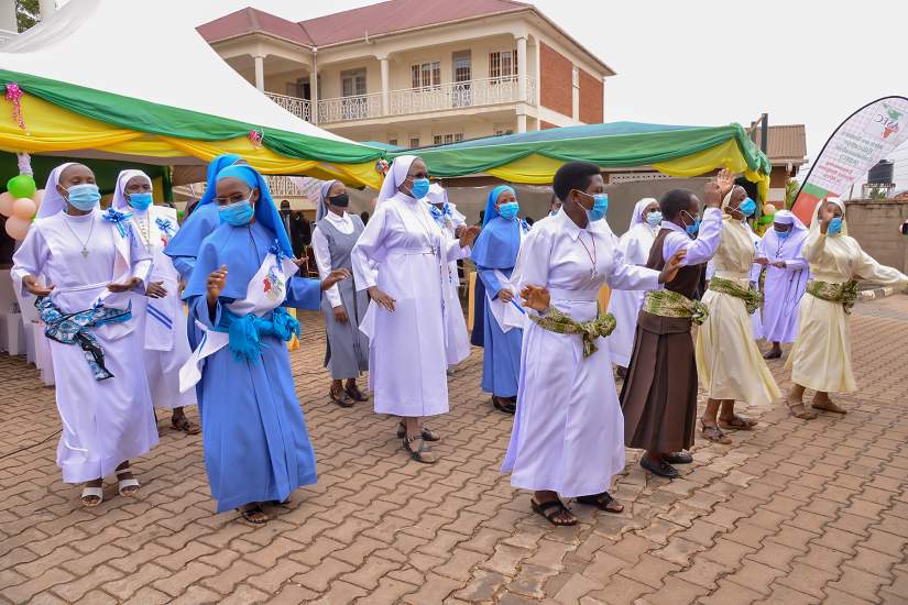 ASEC Sisters dance in celebration at an SLDI graduation ceremony in Uganda.