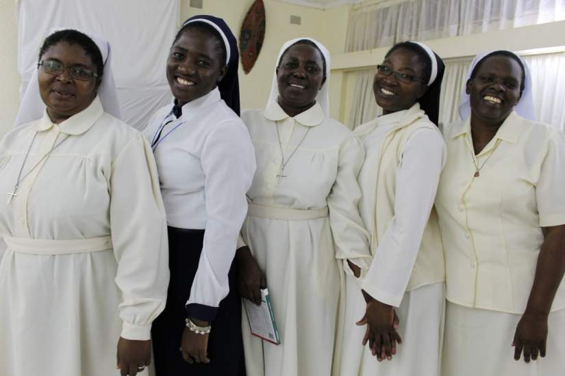 Five Catholic Sister students from Zambia pose for a photo. They are studying for college degrees in the online/onsite hybrid track offered through ASEC's Higher Education for Sisters in Africa (HESA) program.