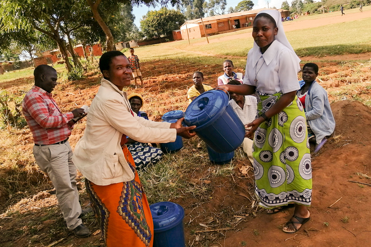 A successful grant proposal by ASEC staff member Sr. Teresa Mulenga, TS, provides members of 5 HIV/AIDS support groups in Malawi with sanitation materials like tap buckets and soap. The members were also taught proper hand-washing techniques to keep them healthy during the COVID-19 pandemic.