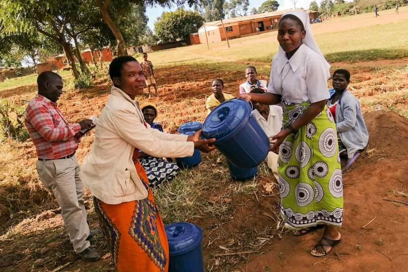 A successful grant proposal by ASEC staff member Sr. Teresa Mulenga, TS, provides members of 5 HIV/AIDS support groups in Malawi with sanitation materials like tap buckets and soap. The members were also taught proper hand-washing techniques to keep them healthy during the COVID-19 pandemic.