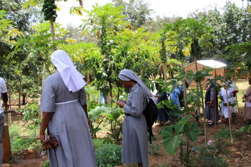 Sr. Rose takes notes during the SLDI Finance II Field Trip to Bigwa Secondary School in Morogoro Tanzania. She plans to use some of the ideas she learned and plans to implement them at the school she works.