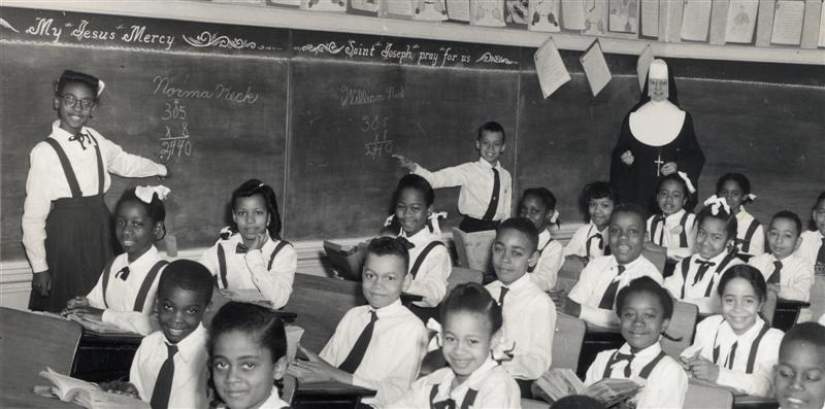 An IHM Sister teaching a class of students (Courtesy of Sisters of IHM).