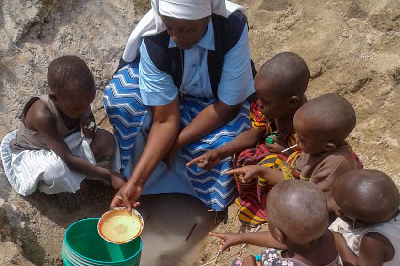 While traveling, Sr. Benedicta takes the time to educate young children about the importance of clean water and how to collect it.