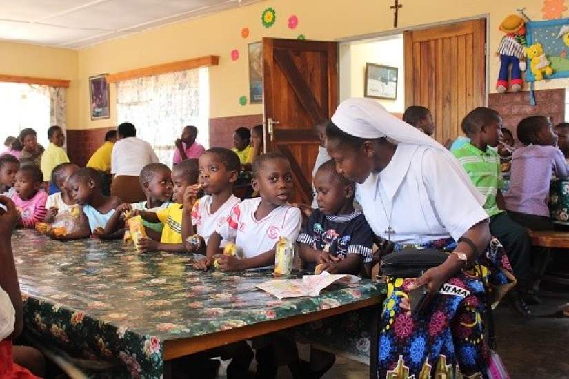 Sr. Teresa Mulenga, TS, ASEC Programs Coordinator in Malawi, working with children.