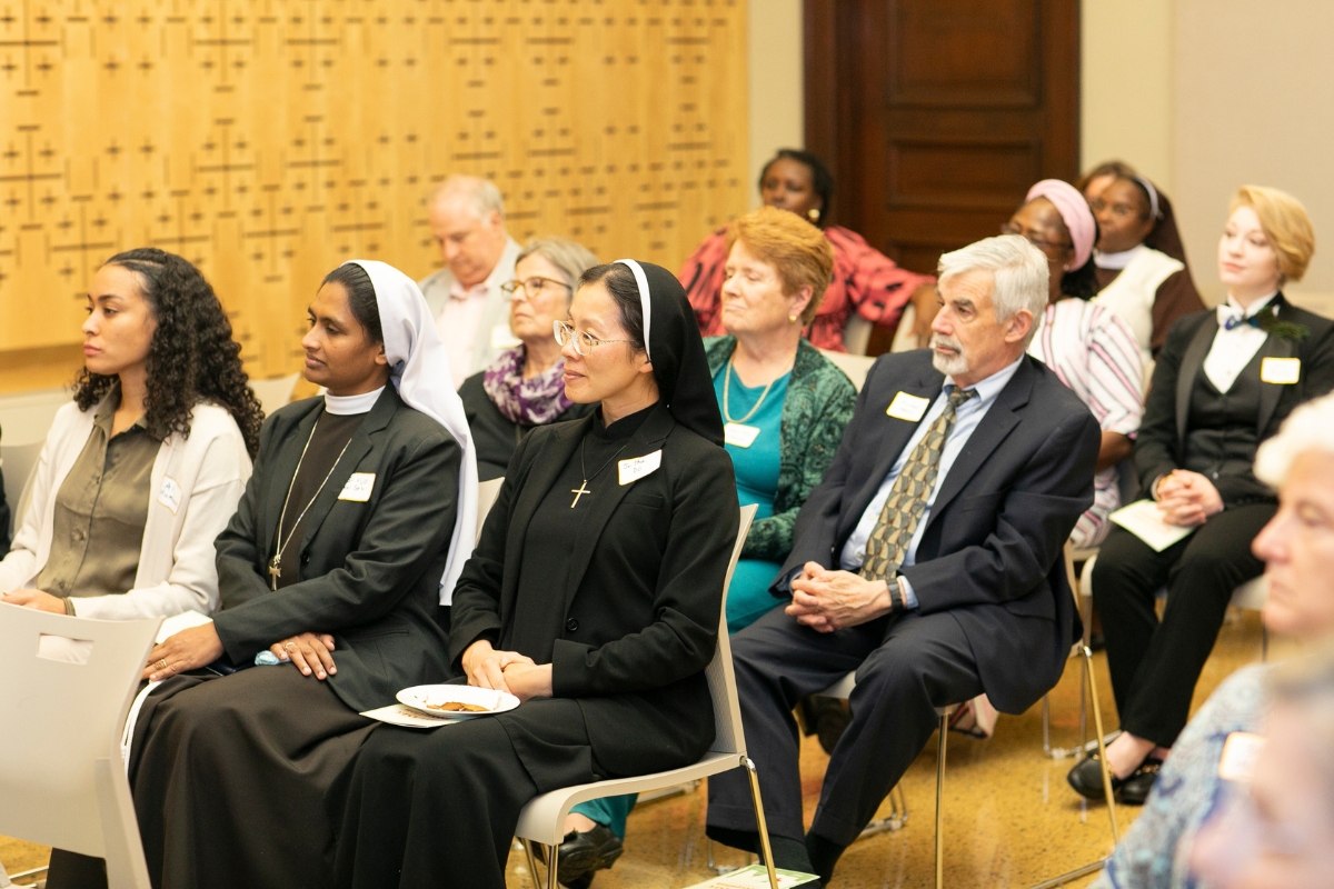 Attendees observe the evening program, reflecting on ASEC’s mission and the impact of educating Catholic sisters in Africa.