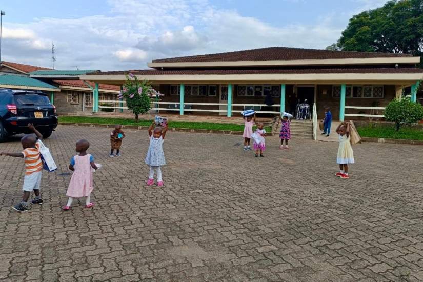 Children at Our Lady of Assumption Mission School in Kenya enjoy outdoor playtime during ASEC’s 2024 Service Learning trip, where participants like Isabella Schmeltzer engaged with students through teaching and cultural exchange.