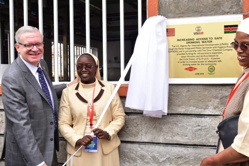 Sr. Esther (left) stands with the U.S. Under Secretary of Commerce, Gilbert Kaplan and a fellow sister at the official opening of the Water Purification Plant.