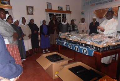 Fr-Davide-blessing-of-the-laptops