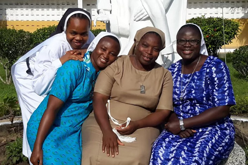 HESA sisters pose for a photo with ASEC West Africa Director, Sr. Clementina, Center.