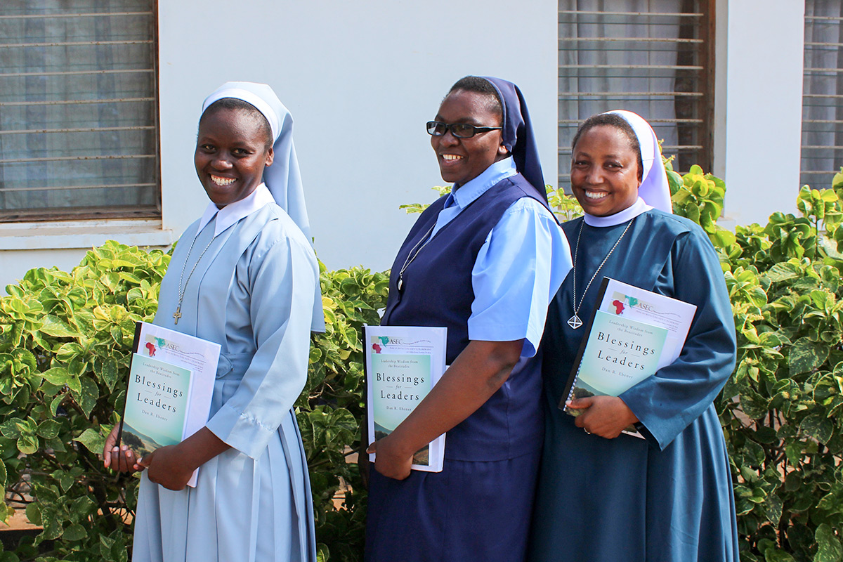 Sr. Agnes Kavishe, SCC, Sr. Jenesia Baraka, ASC and Sr. Mariana Mangu, SCVP pose with their ASEC-SLDI Administration books.